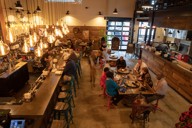 New in the EDGE District, the rustic, industrial restaurant is two stories high with a mezzanine. - Nicole Abbett