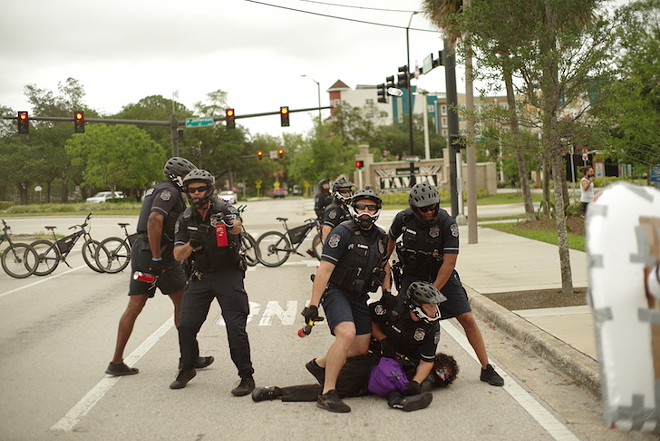 Tampa Police the 'umbrella girl' protestor on June 4, 2020. - Ashley Dieudonne