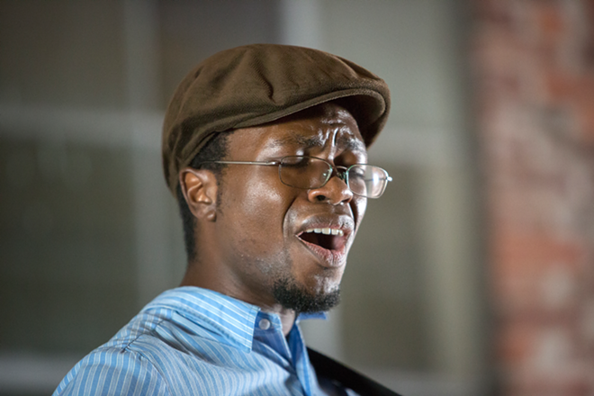 Mwiza demonstrates his soft but inspired voice at The Sofar Sounds concert Saturday night in St Pete. - Chip Weiner