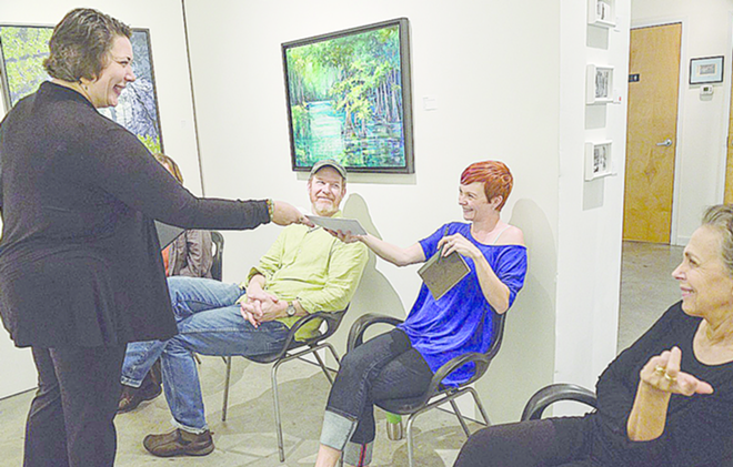 Becca McCoy hands off Lily McDole’s story to dancers Helen Hansen French and Paula Kramer as Matt Cowley looks on during the preparations for Synesthesia last week at The Studio@620. Both Becca and Matt are part of GASP!. - tom kramer