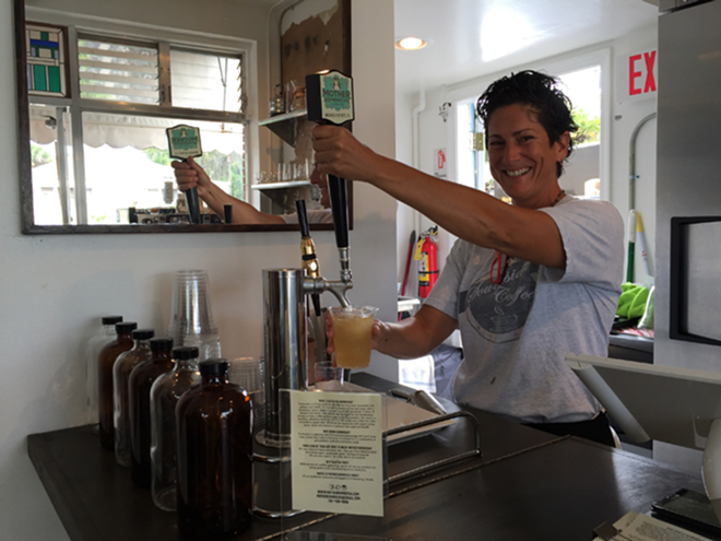 The Southside brew bar's Sheila Smith pours a helping of Mother Kombucha. - Robert Neff, FifthWorldArt.com, @5wa