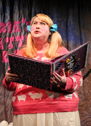 Carrie (Brook McGinnis) of Carrie’s Little Lambs reads from The Gay Agenda. - Sadie Bowman