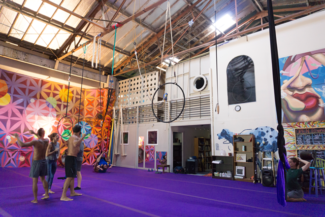 The 7,000 square foot warehouse has the appearance of an adult jungle gym. The ceilings: 35 feet high. - Jennifer Ring