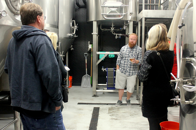 Angry Chair's Ryan Dowdle leads a tour of the Seminole Heights brewery. - Meaghan Habuda