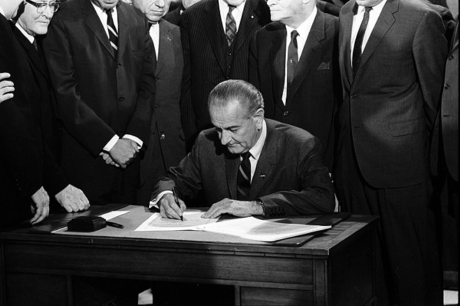 President Lyndon B. Johnson signs the Voting Rights Act of 1965. - Creative Commons/Library of Congress