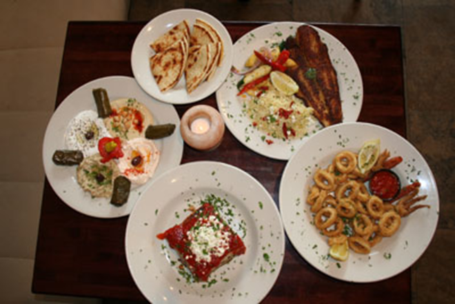 Appetizer platter (far left) and other goodies at Acropolis. - Dawn Morgan