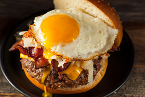 Bacon and egg top the Diner Deluxe Burger. - Courtesy of Tarpon Diner