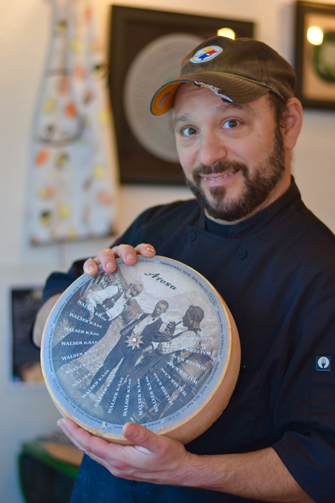 Brooklyn South owner Matt Bonano and his newly delivered cheese. - Angelina Bruno