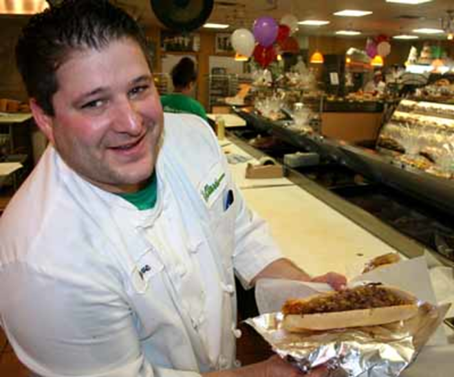 LIKE BEING BACK IN PHILLY: Grill man David Maffei cooks cheesesteaks at Alessi. - Eric Snider