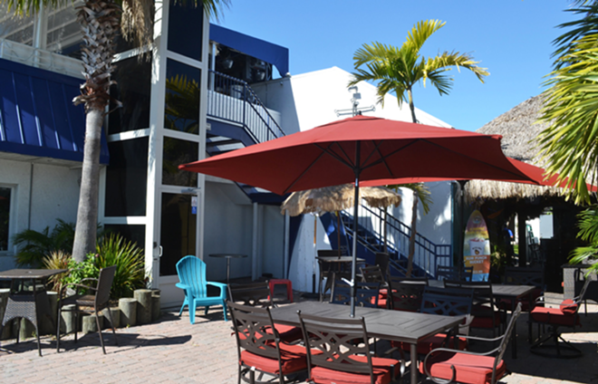 Spinnakers' patio is part of the outdoor tiki bar, one of its three themed bars. - Ryan Ballogg