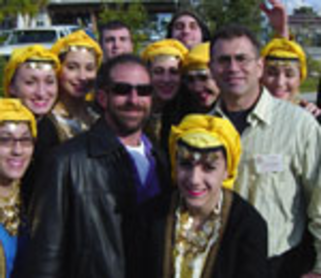 THE CHOSEN: Alex Joanow, left, and Chuck Kyriakou, retrievers of the cross in 1988 and 1986, with the Polenic Dancers of New Jersey. - Max Linsky
