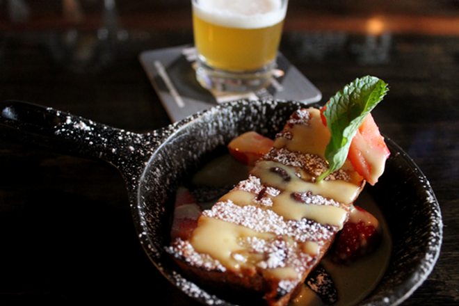 Urban Comfort's swoon-worthy bread pudding dusted with powdered sugar. - Meaghan Habuda