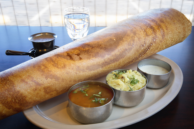 Masala dosa, a thin rice crepe, filled with spiced potatoes and onions. - Chip Weiner
