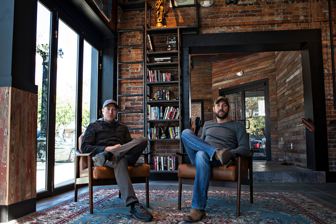 Rock Brothers Brewing founders Kevin Lilly (L) and Tony Casoria sit in their new tasting room on January 9, 2017. - J.T. Brown