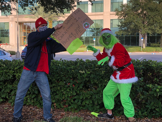 Tampa Bay nurses, and the Grinch, deliver coal to local headquarters of HCA Healthcare