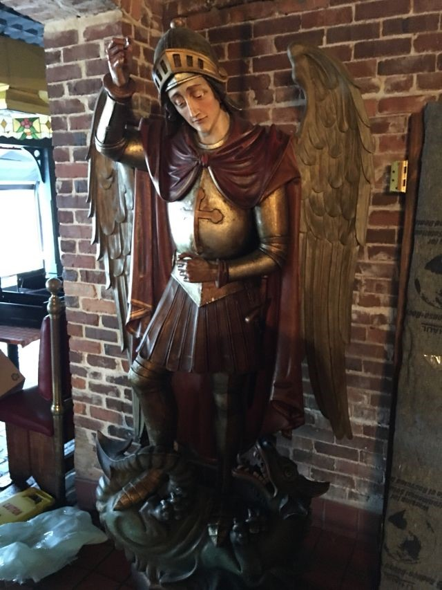 This Angel disguised as a knight is one of the many Spaghetti Warehouse items up for bid. - RestaurantEquipment.Bid