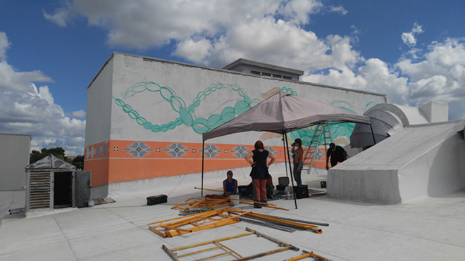 The mural team taking a break in the heat of the sun - Hope Donnelly