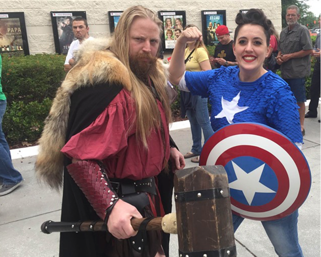 "Thor" and Jackie Roberts of Riverview's Two Faeries and a Dwarf costume business await screening of Captain America: Civil War at the AMC Veterans in Tampa. - Ray Lehmann