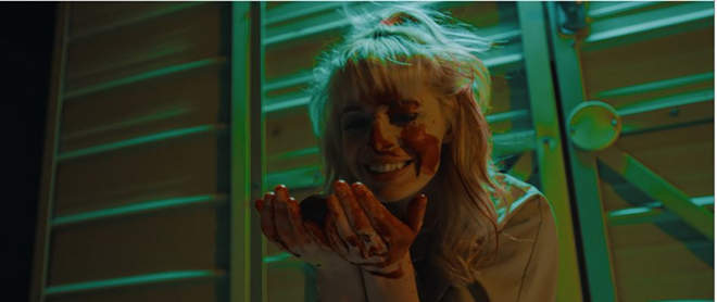 Regina (Chloe Farnworth) takes an up-close-and-personal approach to her job as an organ thief in "12 Hour Shift" - Magnolia Pictures/Magnet Releasing