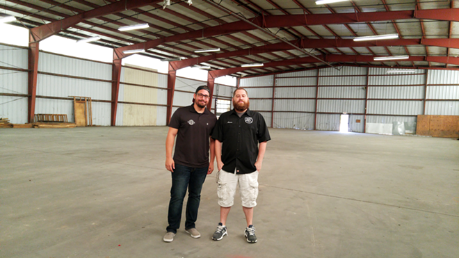 Brenden Markopoulos and Aaron Barth inside the big building that will house their brewhouse. - Meaghan Habuda