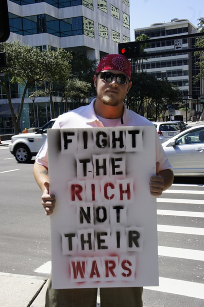 Josh, 22, of New Port Richey joined in his first protest Saturday at Occupy Tampa's Rally at Gaslight Park - Arielle Stevenson