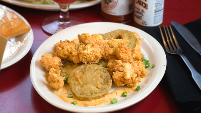 Fried green tomatoes are served alongside a pile of crisp, popcorn-style crawfish. - Chip Weiner