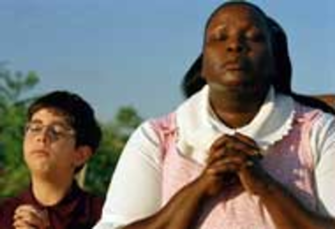 JOINT WORSHIP: Peter Paul (Alexander Brickel) and Aviva (Sharon Wilkins) pray together. - Macall Polay
