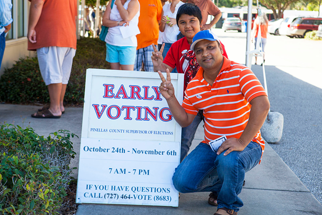 St. Pete's Mohammad Uddin and his son Sadman Sakin Uddin, 10, were posing for their cousin after voting at the Gulfport Community Center. It was the second time Uddin has voted. - Kimberly DeFalco