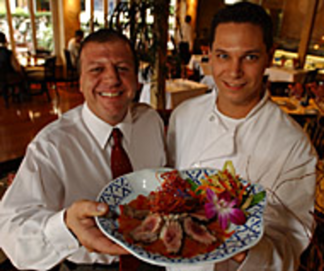 FANCY: Proprietor Alberto Mastromano - and Executive Chef James W. Keene offer up an - entree of seared duck breast with mango cranberry - sauce and Port wine reduction. - Sean Deren