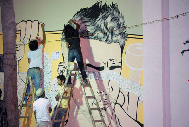 MURAL IN PROGRESS: Tarek at work on an Alexandria mural. - Courtesy of USFCAM