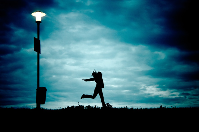 Woman running at night - Pixabay