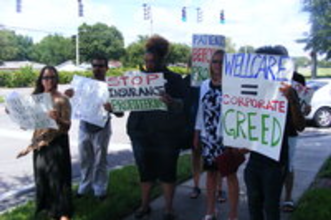 Members from  Florida PIRG, Organize Now, and the Florida Consumer Action Network in front of Well Care headquarters - Atecia Robinson