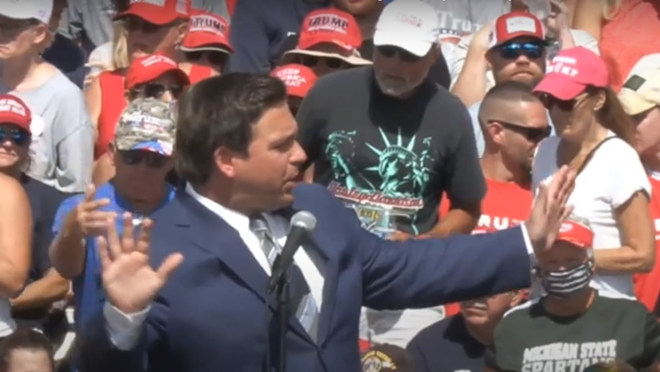 Gov. Ron DeSantis manages traffic for medical personnel ahead of President Donald Trump's rally in Tampa. - Image via Youtube/Right Side Broadcasting Network.