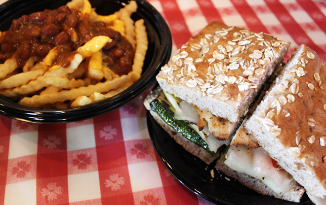 Portillo's many hacks include chili cheese fries and the charbroiled chicken and grilled veggie sando. - MEAGHAN HABUDA