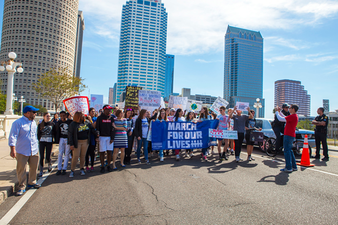 The Tampa March for our Lives parades through downtown Tampa. - Kate Bradshaw