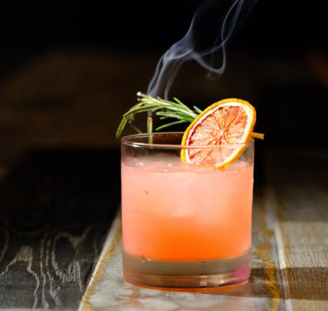 "I'll Have What She’s Having," made with Zubrowka Bison Grass Vodka, a house-made pearlescent blood orange cordial, lemon and a house-made rosemary simple syrup. Designed by Debbie Chennault (Bartender) - PAT RIELI