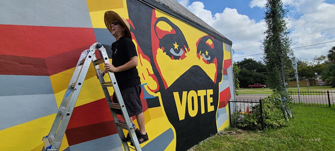 Chad Mize in front of his 'VOTE' mural at Independent Bar in Tampa on Oct. 27, 2020. - Ray Roa