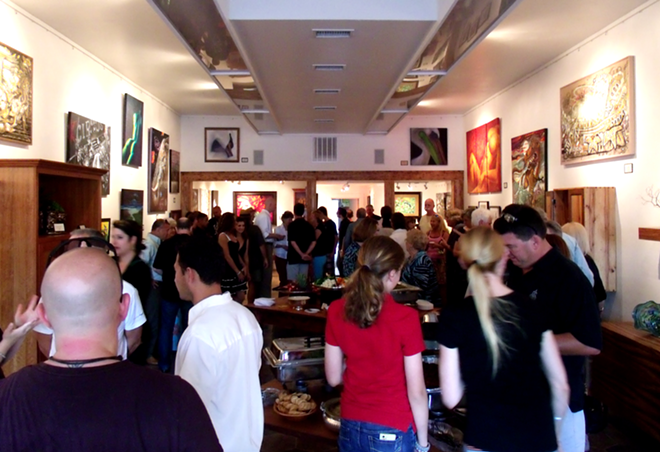 INSIDE THE GALLERY: A crowd gathers at McKenzie's opening. - DANNY OLDA