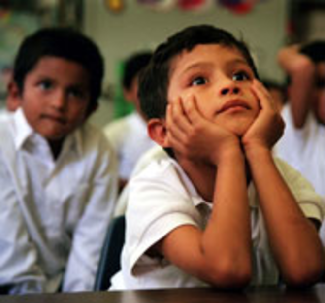 FUTURE INVESTMENT: At the San Jose Migrant - School in east Hillsborough County, parents are - enlisted as partners in their children's education. The - school also helps families with health and - social-services needs. Here, first grader Alberto - Castillo, 6, pays close attention during one of his - classes. - Barbara P. Hernandez