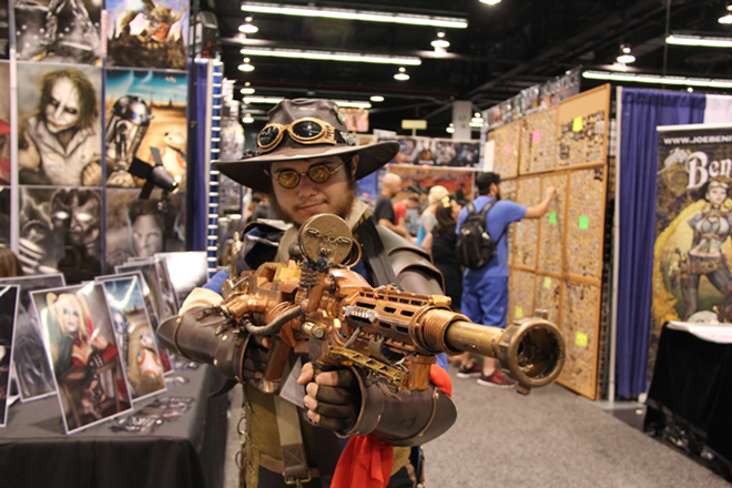 A cosplayer at WonderCon 2015 shows off his steampunk gun. - William Tung via Wikimedia Commons/CC