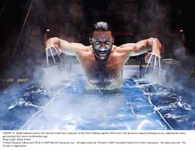 WET AND WILD: Actor Hugh Jackman, portraying Wolverine, in a scene from the upcoming movie. - James Fisher