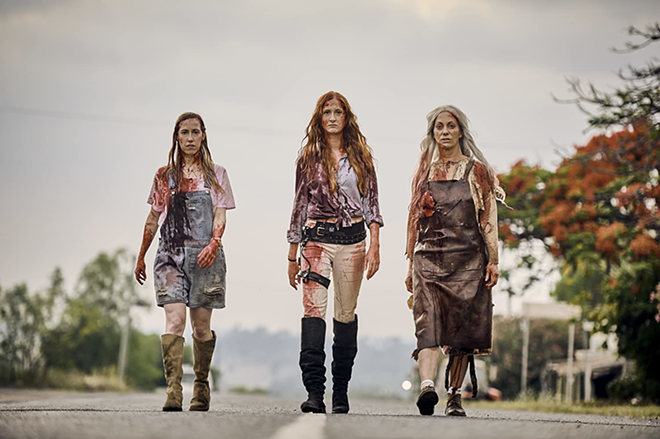 Annabelle, center, flanked by her sister Daisy, left, and mother Mary, right, model their best blood couture from "Two Heads Creek." - The Horror Collective