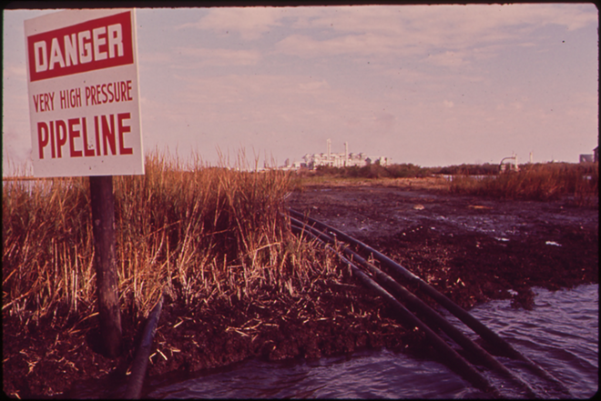 WARNING SIGNS: A natural gas pipeline in Louisiana’s Rattlesnake Bayou, circa 1972. - Wikimedia Commons/U.S. National Archives