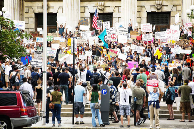 STEPPING UP: Protesting on the steps of the federal courthouse Oct. 6. - Shanna Gillette