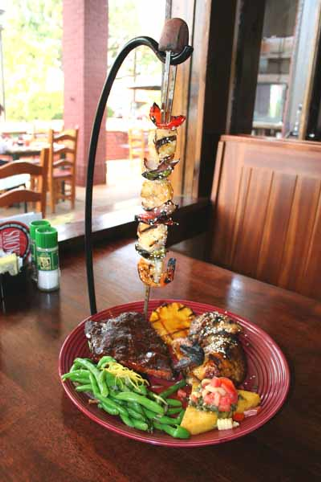 YOUR 'CUE TO DIG IN: A specialty kebab towers over a plate of Smoke's ribs, chicken and other tasty sides. - Eric Snider
