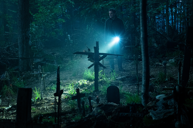 Atmosphere is everything in Pet Sematary, and the film piles on the dread, gorgeously capturing the ancient burial ground that lies just beyond these headstones. - Kerry Hayes/Paramount Pictures
