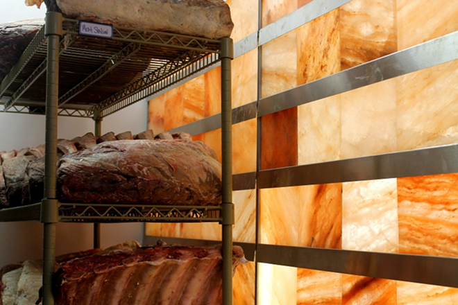 The dry-aging room, lined with blocks of Himalayan salt. - Meaghan Habuda
