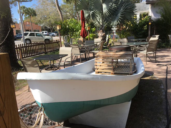 An old boat and crab traps are part of Fish's outdoor dining decor. - Cathy Salustri