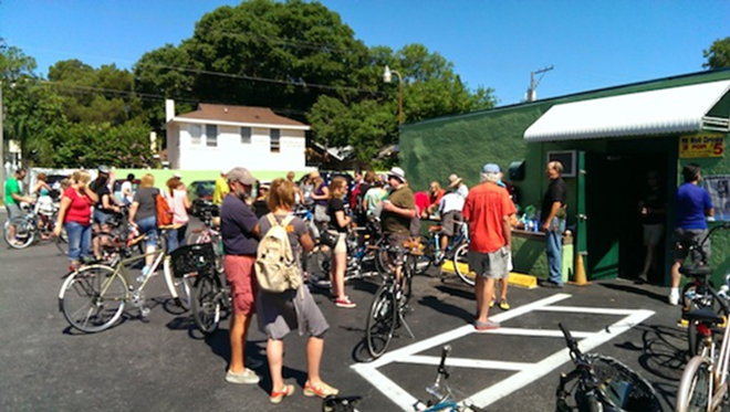 Riders gather to register for the Kerouac in Paradise Bike Tour. - SCOTT HARRELL