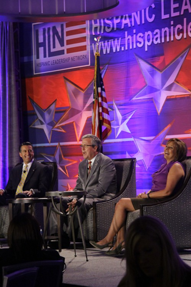 Former Governor Jeb Bush, and Governors Susana Martinez and Brian Sandoval address a crowd in the InterContinental hotel in Tampa Tuesday. - Joshua Santos